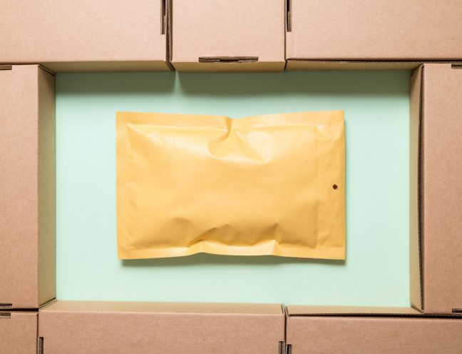 Lot of brown cardboard boxes with envelope